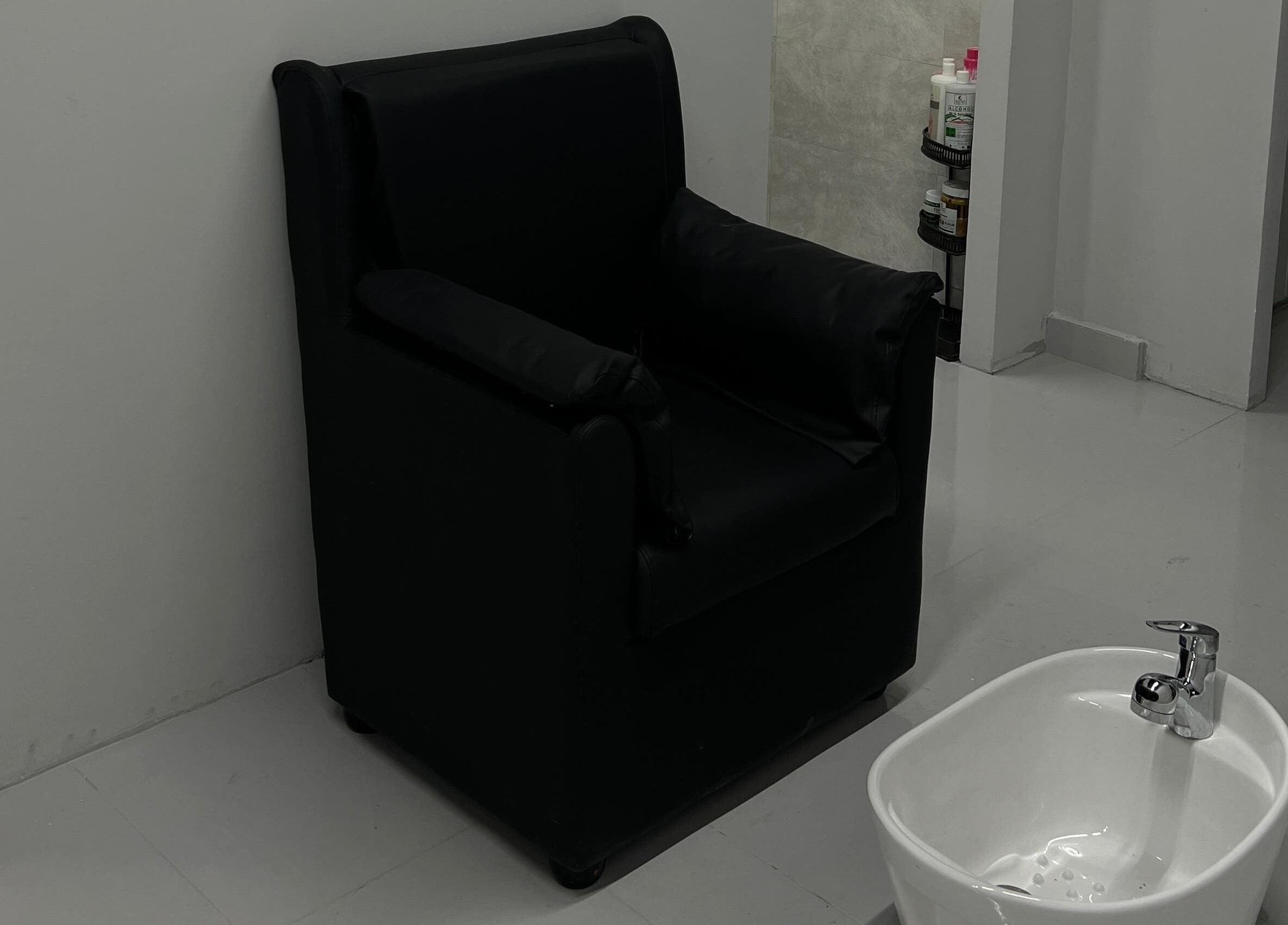 Comfortable black pedicure chair at The Barber Lab, Sharjah, Sharjah, AE, enhances wellness experience.