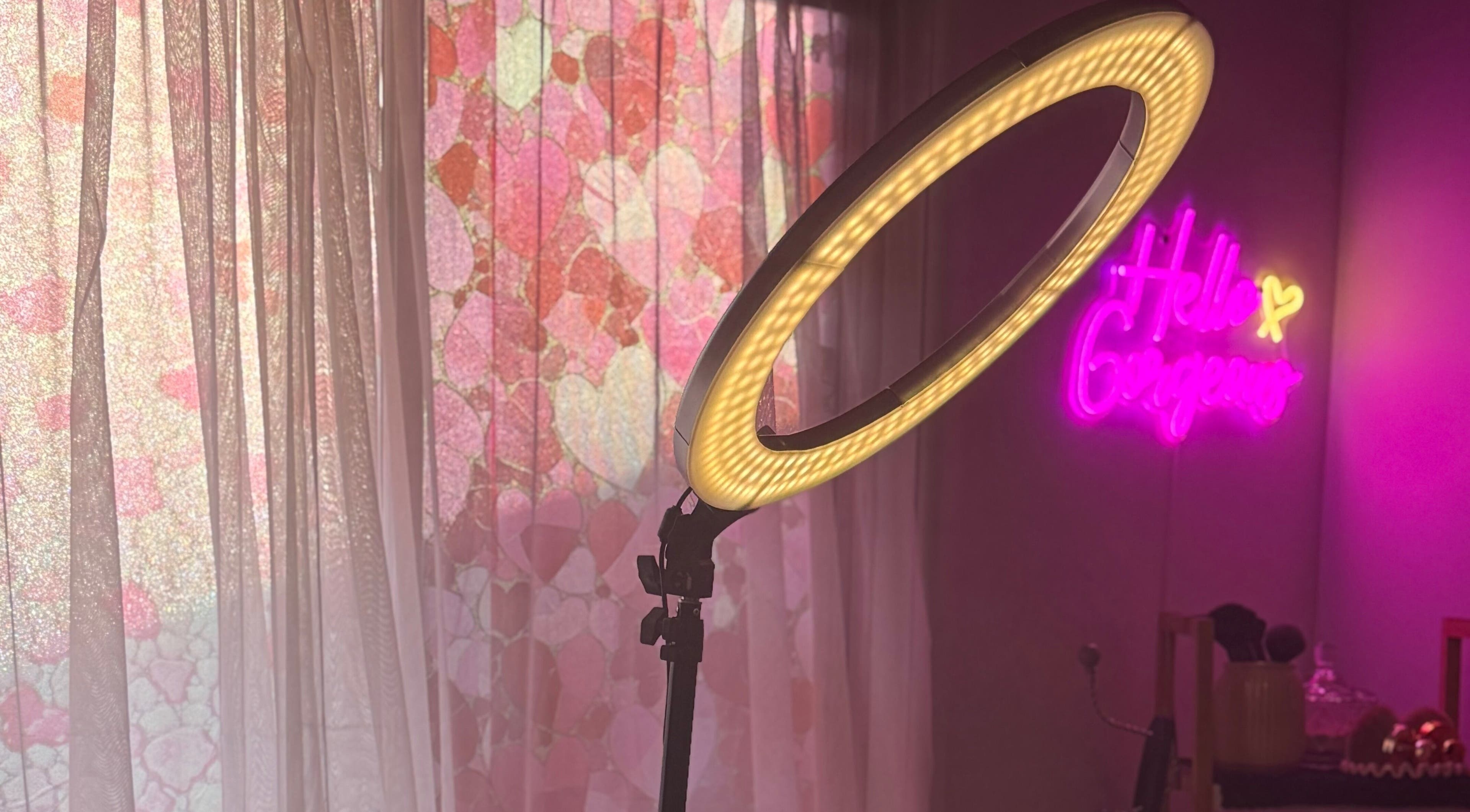 Glamorous lighting setup at Magnetic Glow, Redcliffe, Queensland, AU, with neon sign and pink decor.