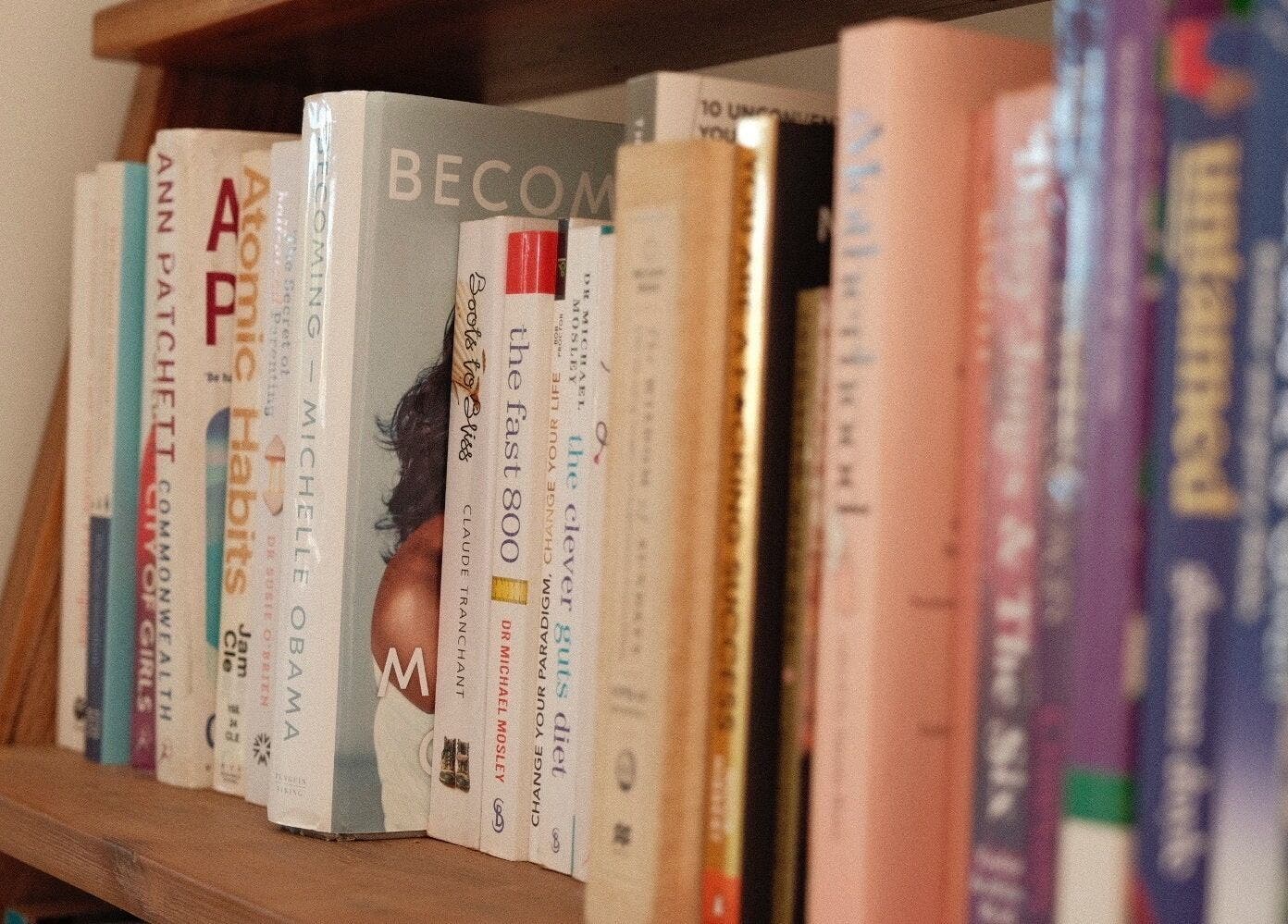 Bookshelf in Magnetic Glow's lounge area, Redcliffe, Queensland, AU, adding a cozy reading ambiance.