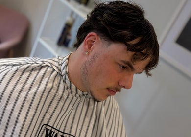 Fresh hairstyle at Illusion Barbers, Cannock, England, GB. Modern cut with precision styling.