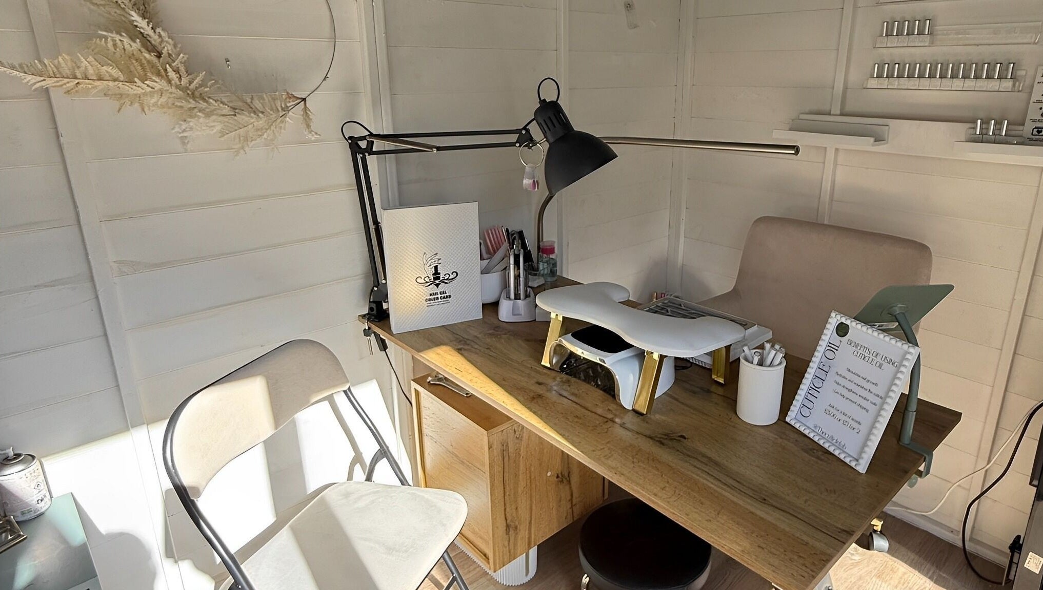 Manicure station at Polished by Kate in Constantine, England, GB, featuring stylish decor and tools.