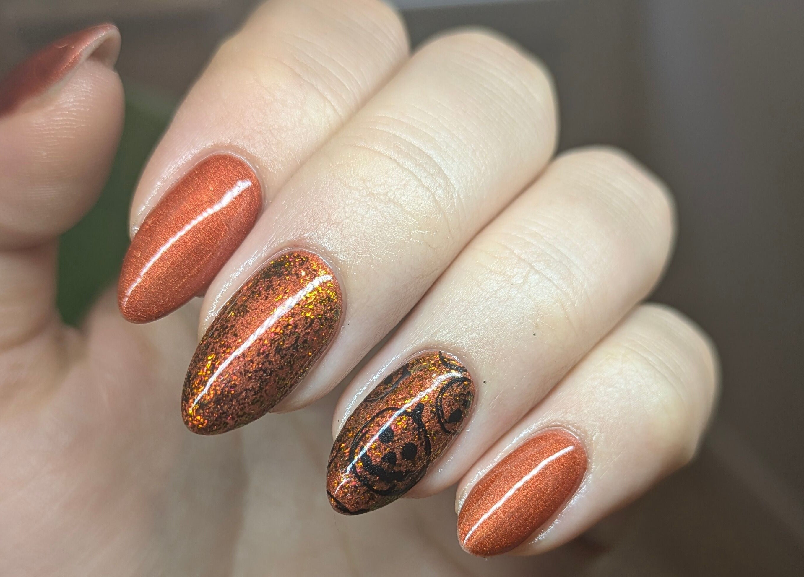 Gleaming copper-colored nails with intricate design at The Nail Alchemist, Knaresborough, England, GB.