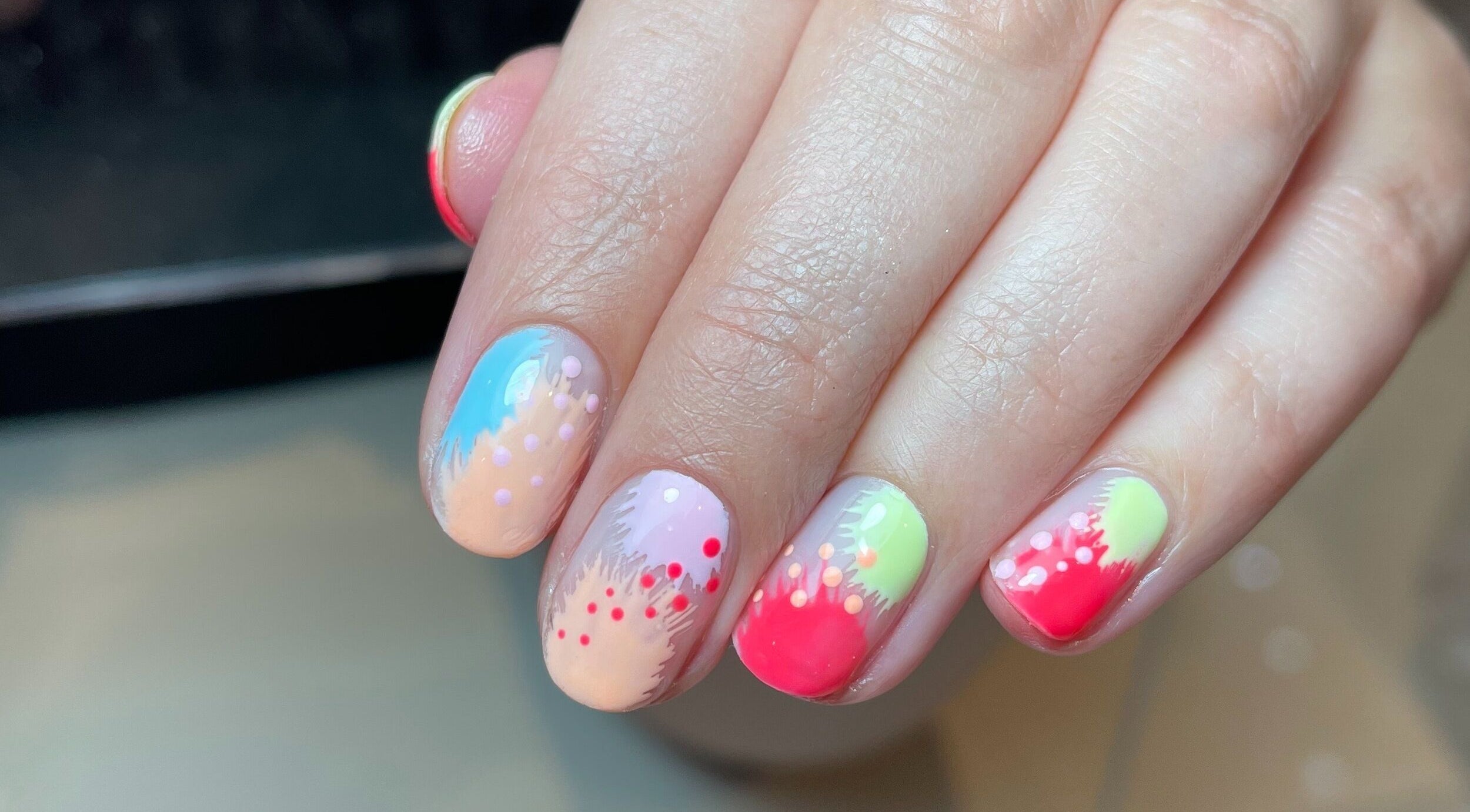 Colorful nail art at The Nail Alchemist in Knaresborough, England, GB, showcasing vibrant creative designs.