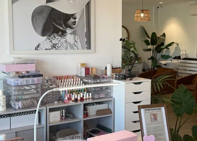 Chic interior of Lumi Nail Bar, Southport, Queensland, AU featuring stylish decor and manicure display.