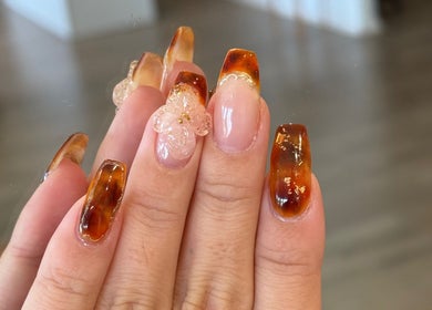 Beautiful autumn-themed acrylic nails at Lumi Nail Bar, Southport, Queensland, AU with floral design.