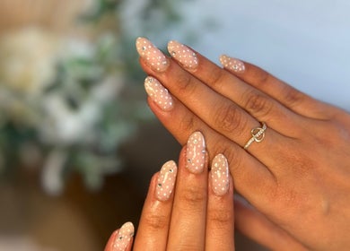 Stylish polka-dotted nails at Lumi Haus Beauty Bar, Goldcoast, Queensland, AU, showcasing intricate designs.