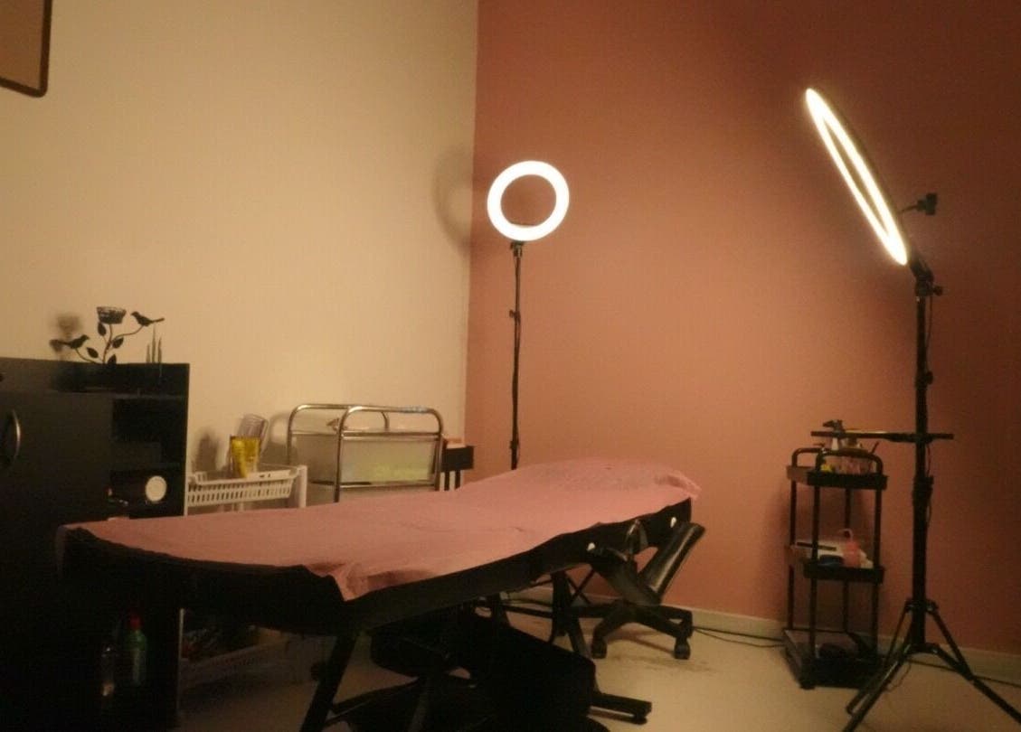 Serene treatment room at DazznAesthetics, Strathnairn, ACT, AU featuring ambient lighting and a treatment bed.