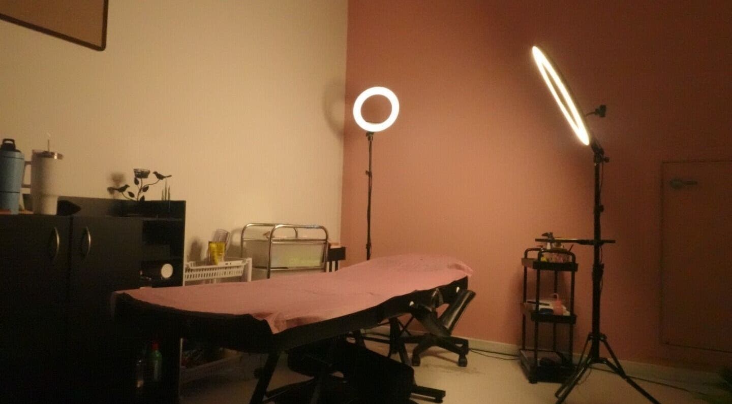 Serene treatment room at DazznAesthetics, Strathnairn, ACT, AU featuring ambient lighting and a treatment bed.