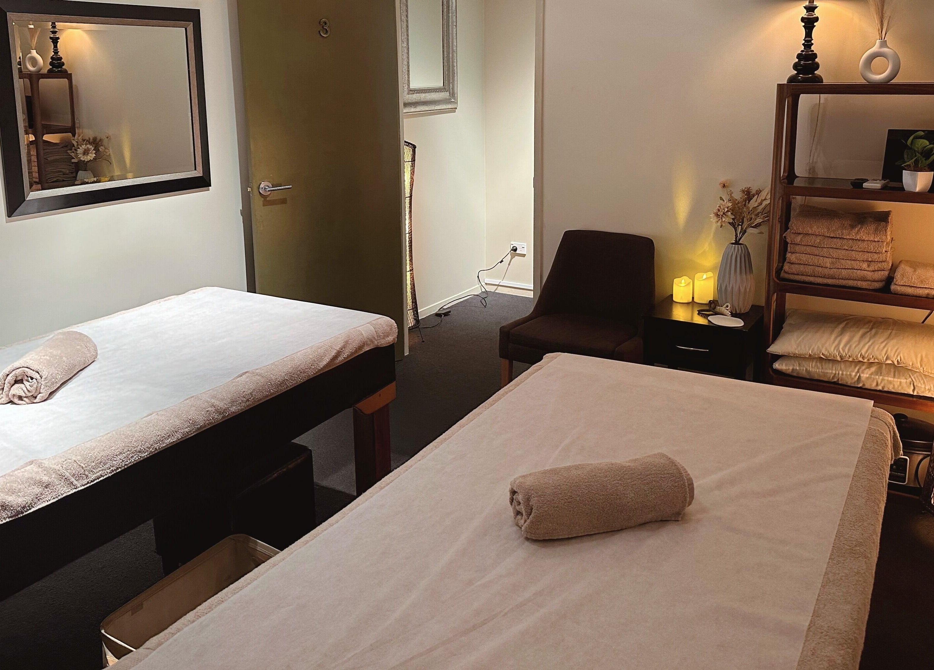 Relaxing massage room at Zen Japanese Massage Platinum - Auckland CBD with serene lighting, Auckland, NZ.