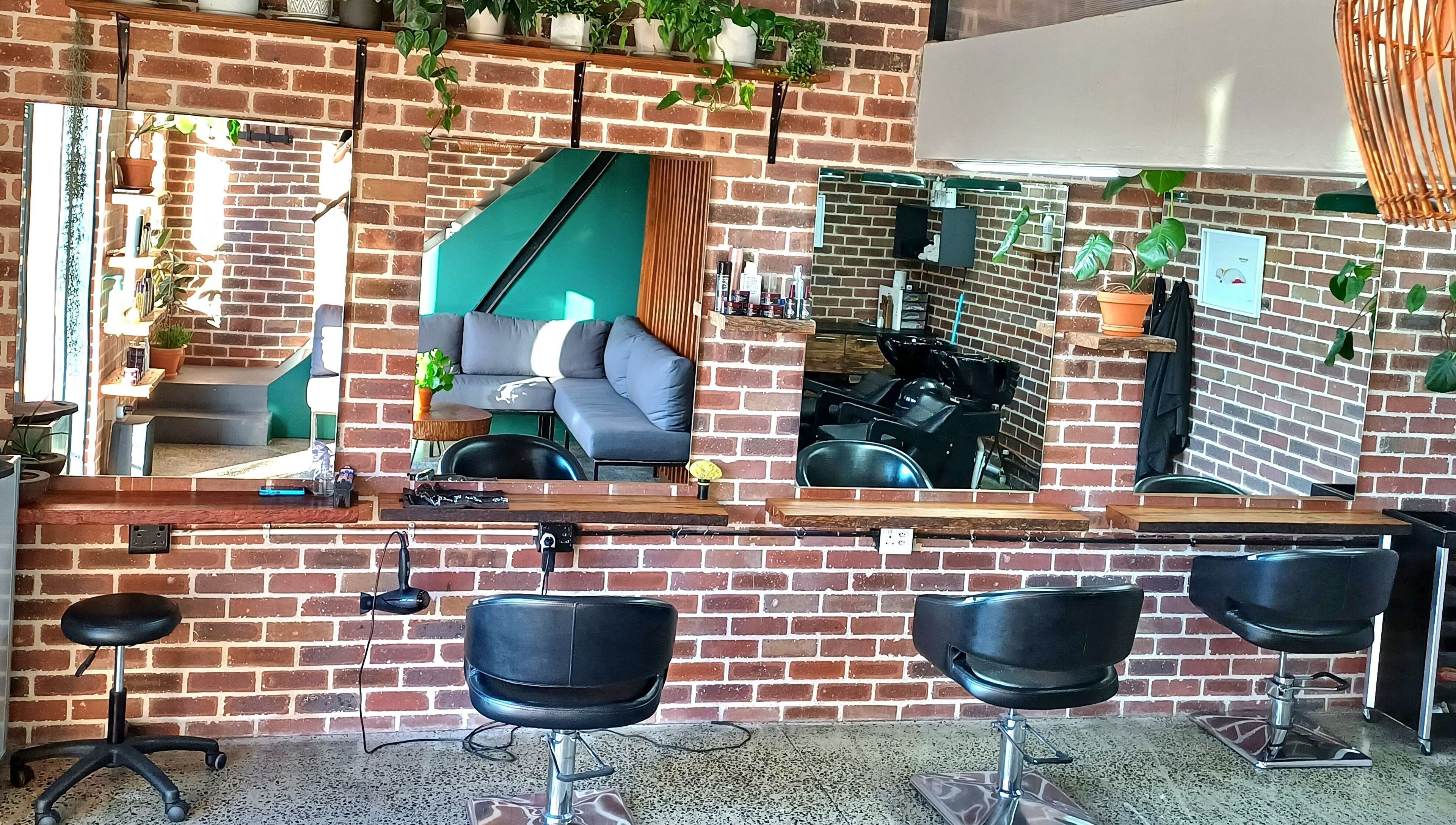 Stylish salon interior at The Hadfield Hair in Cape Town, Western Cape, ZA with modern decor and seating.