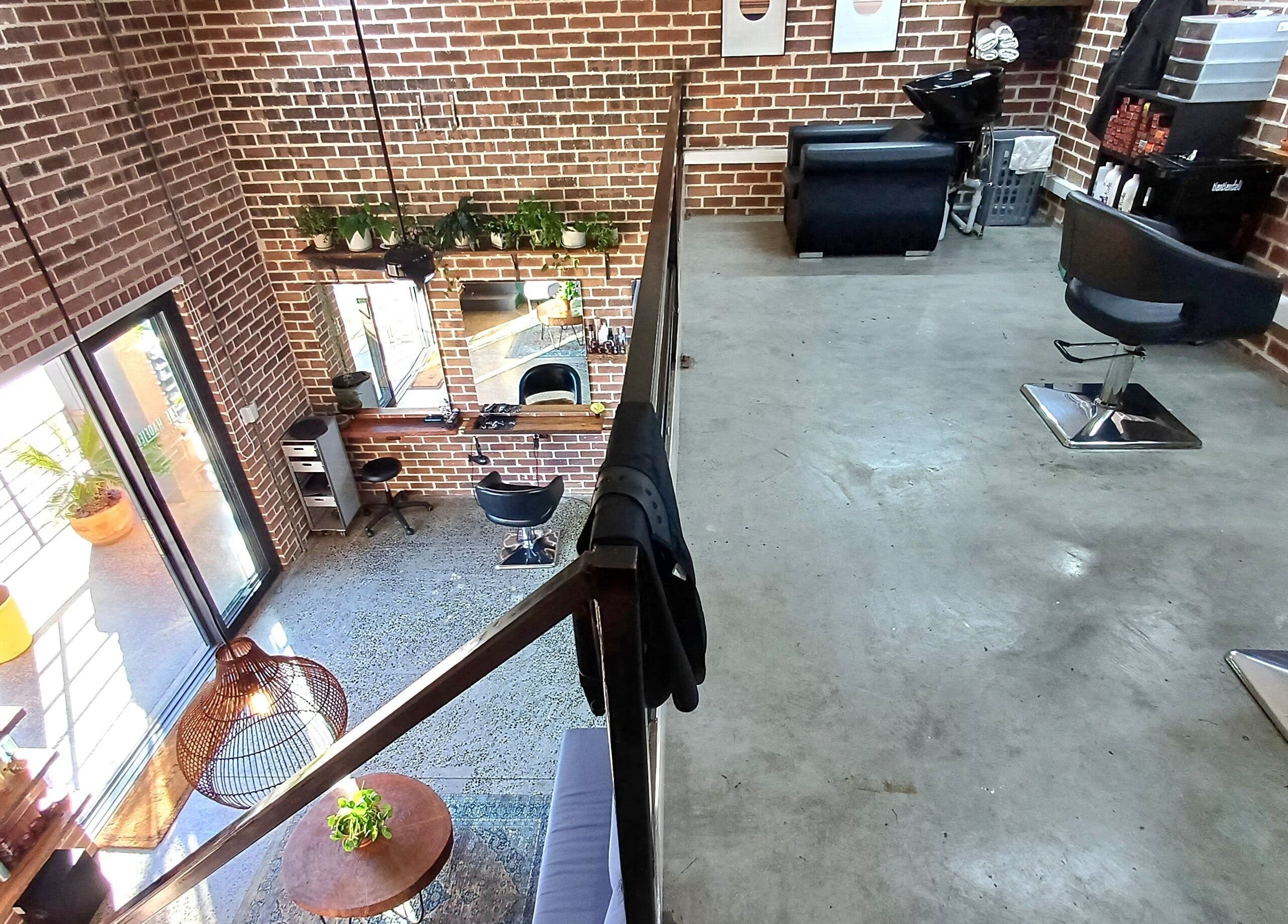 Stylish salon interior at The Hadfield Hair, Cape Town, Western Cape, ZA, featuring modern design and greenery.