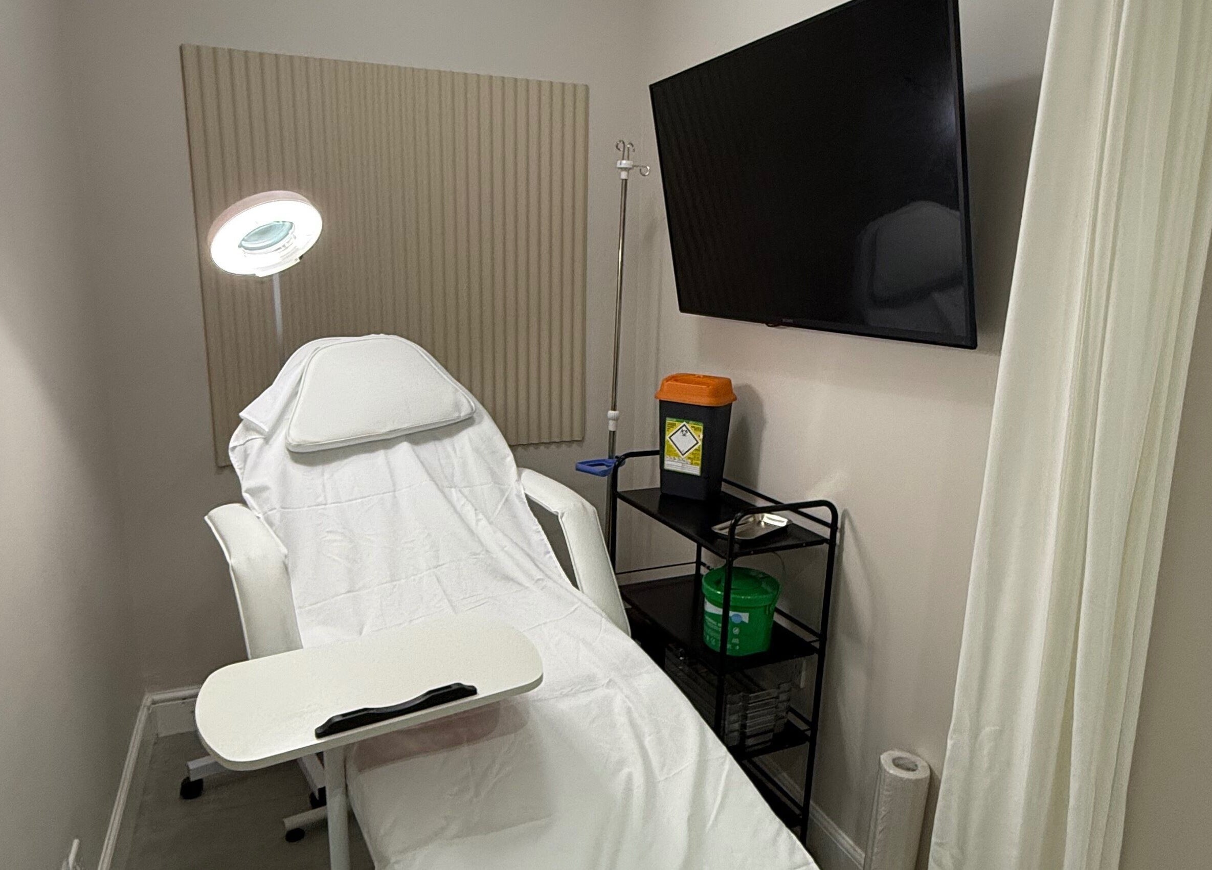 Relaxing treatment room at The Collective, Edinburgh, Scotland, GB equipped with a comfortable chair and modern facilities.