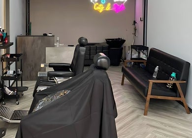 Trendy salon interior at Platinum Cutz & Style - EAST, Marine Parade, Singapore, SG featuring modern decor and seating.