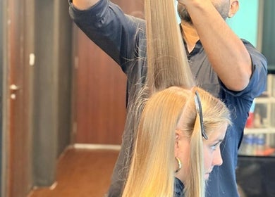 Stylist perfecting hair at Platinum Cutz & Style - WEST, Bouna Vista, Singapore, SG.