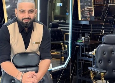 Barber at Platinum Cutz & Style - WEST, Bouna Vista, Singapore, SG, with elegant black chairs.