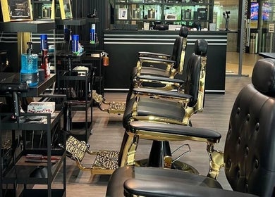 Luxurious barber chairs at Platinum Cutz & Style - WEST, Clementi, Singapore, SG, showcasing style and comfort.