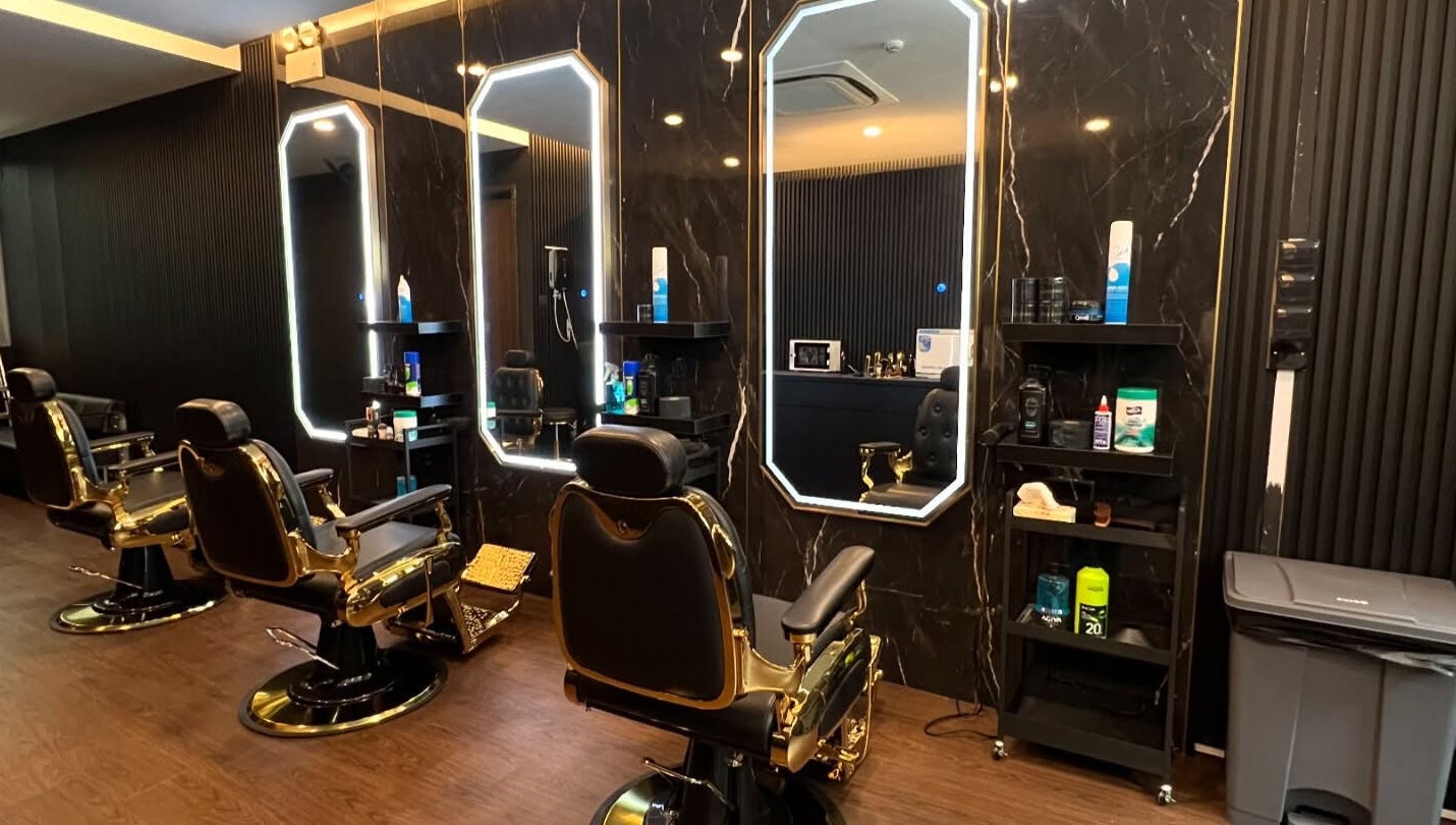 Elegant barber chairs at Platinum Cutz & Style - WEST, Clementi, Singapore, SG in a stylish setting.