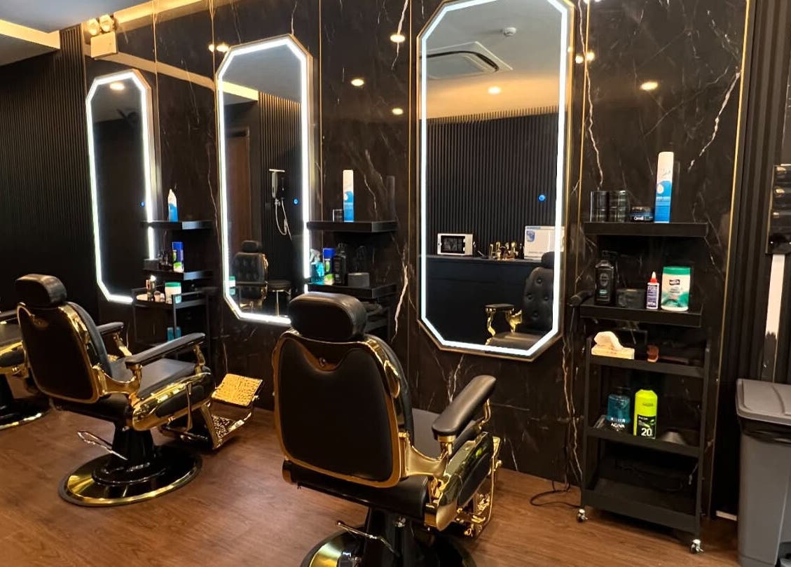 Elegant barber chairs at Platinum Cutz & Style - WEST, Clementi, Singapore, SG in a stylish setting.