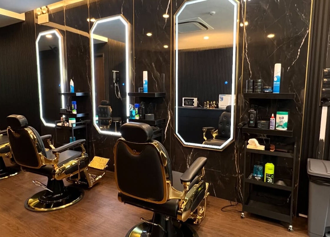 Elegant barber chairs at Platinum Cutz & Style - WEST, Clementi, Singapore, SG in a stylish setting.