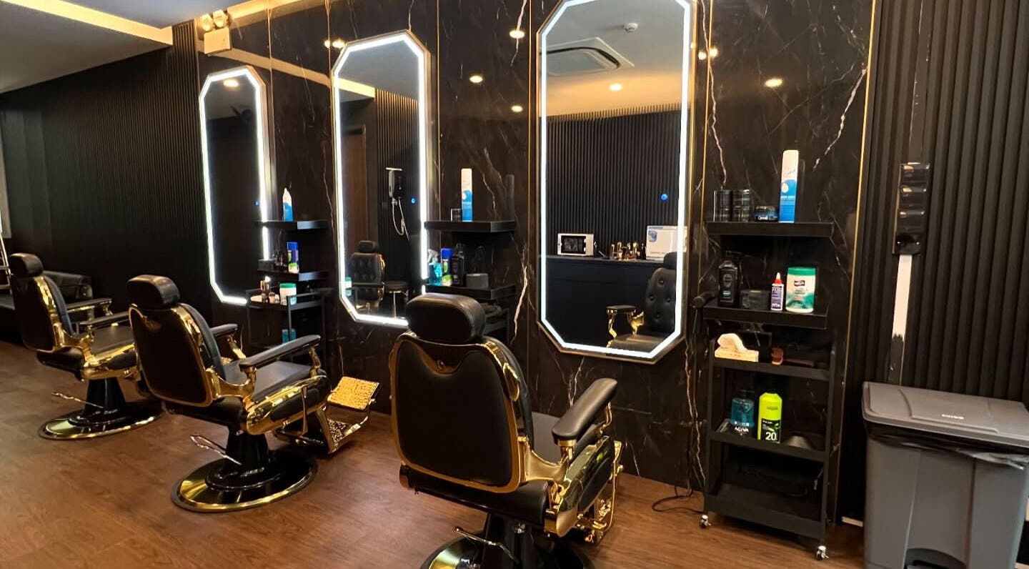 Elegant barber chairs at Platinum Cutz & Style - WEST, Clementi, Singapore, SG in a stylish setting.