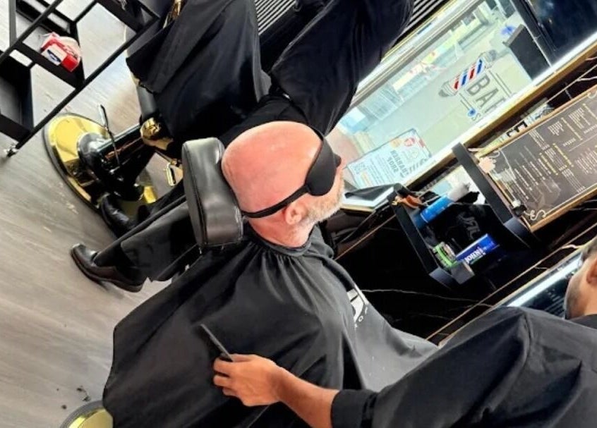 Man receiving a haircut at Platinum Cutz & Style - WEST, located in Clementi, Singapore, SG.