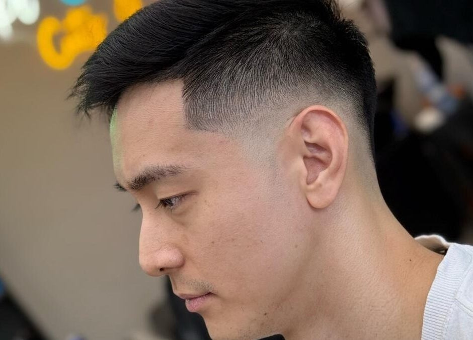 Fresh fade haircut expertly done at Platinum Cutz & Style - WEST, Clementi, Singapore, SG, showcasing modern style.