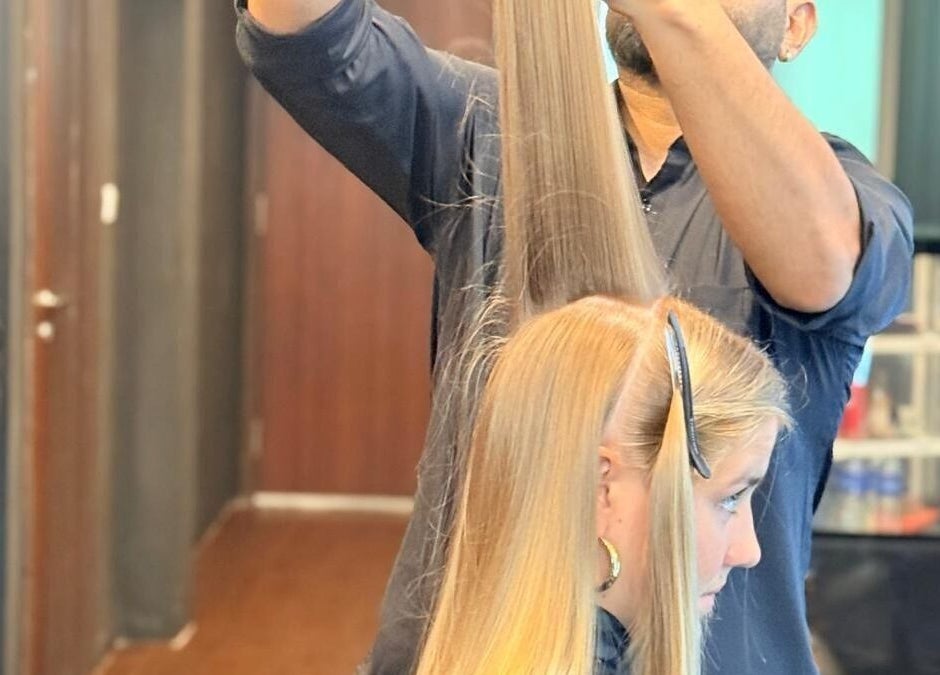 Hair stylist perfecting a sleek cut at Platinum Cutz & Style - WEST, Clementi, Singapore, SG.