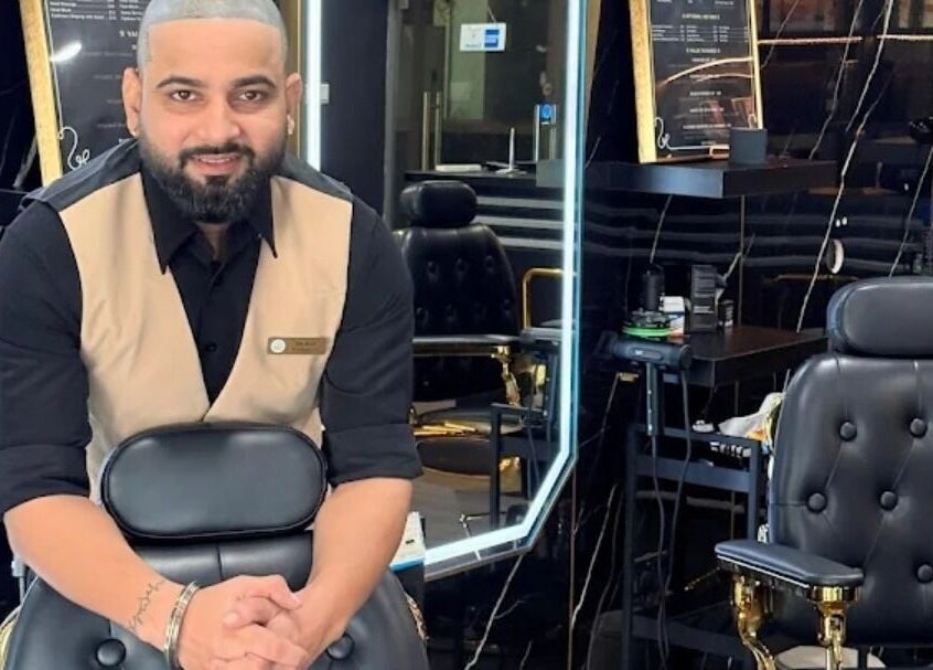 Interior of Platinum Cutz & Style - WEST in Clementi, Singapore, showcasing a stylish barber chair and sleek decor.