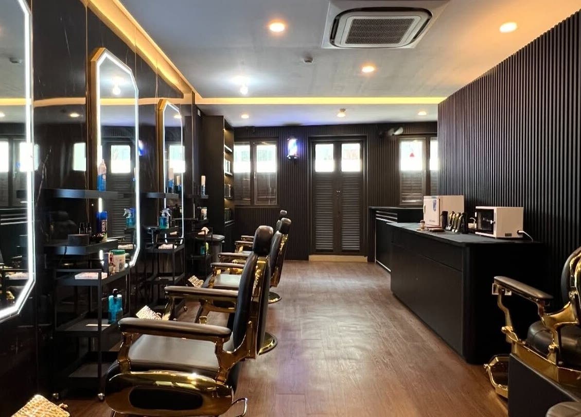Upscale barber chairs and elegant decor at Platinum Cutz & Style - CENTRAL, Orchard, Singapore, SG.