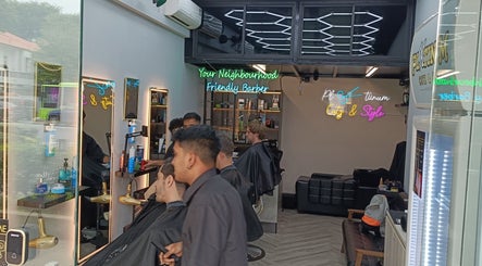 Interior of Platinum Cutz & Style - EAST at Marine Parade, Singapore, SG showcasing modern barber chairs and vibrant decor.