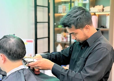 Stylist gives precise haircut at Platinum Cutz & Style - EAST, Marine Parade, Singapore, SG.