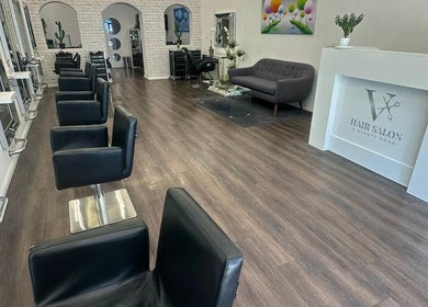 Modern interior of V Hair Salon Bondi, Bondi, New South Wales, AU with stylish chairs and decor.