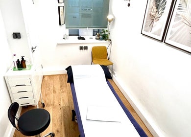 Tranquil massage room at Wellbeing Massage & Pain Relief in Covent Garden, London, England, GB with minimal decor.