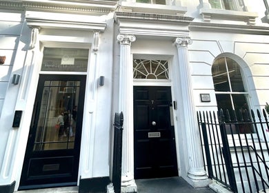 Entrance of Wellbeing Massage & Pain Relief in Covent Garden, London, England, GB, showcasing classic architecture.