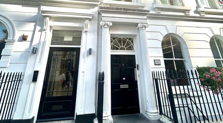 Entrance of Wellbeing Massage & Pain Relief in Covent Garden, London, England, GB featuring classic architecture.