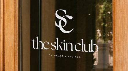 Entrance door of The Skin Club, Leeds, England, GB showcasing elegant logo design.