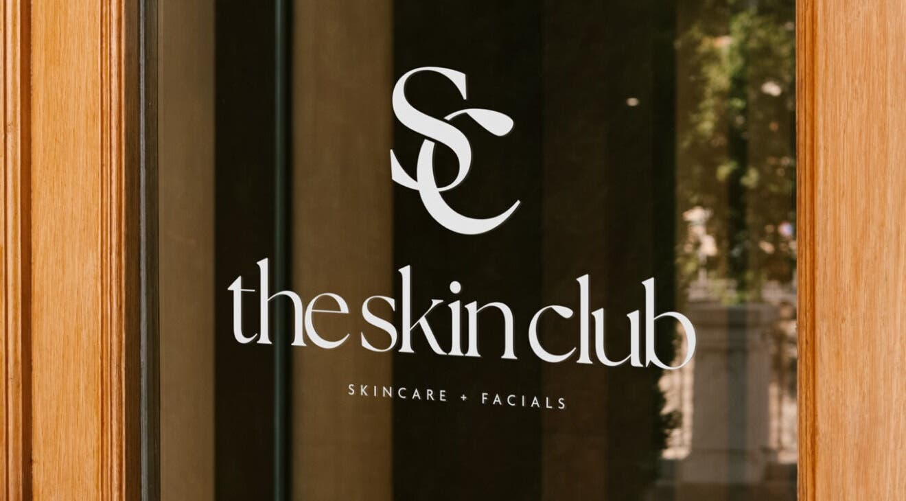 Entrance door of The Skin Club, Leeds, England, GB showcasing elegant logo design.