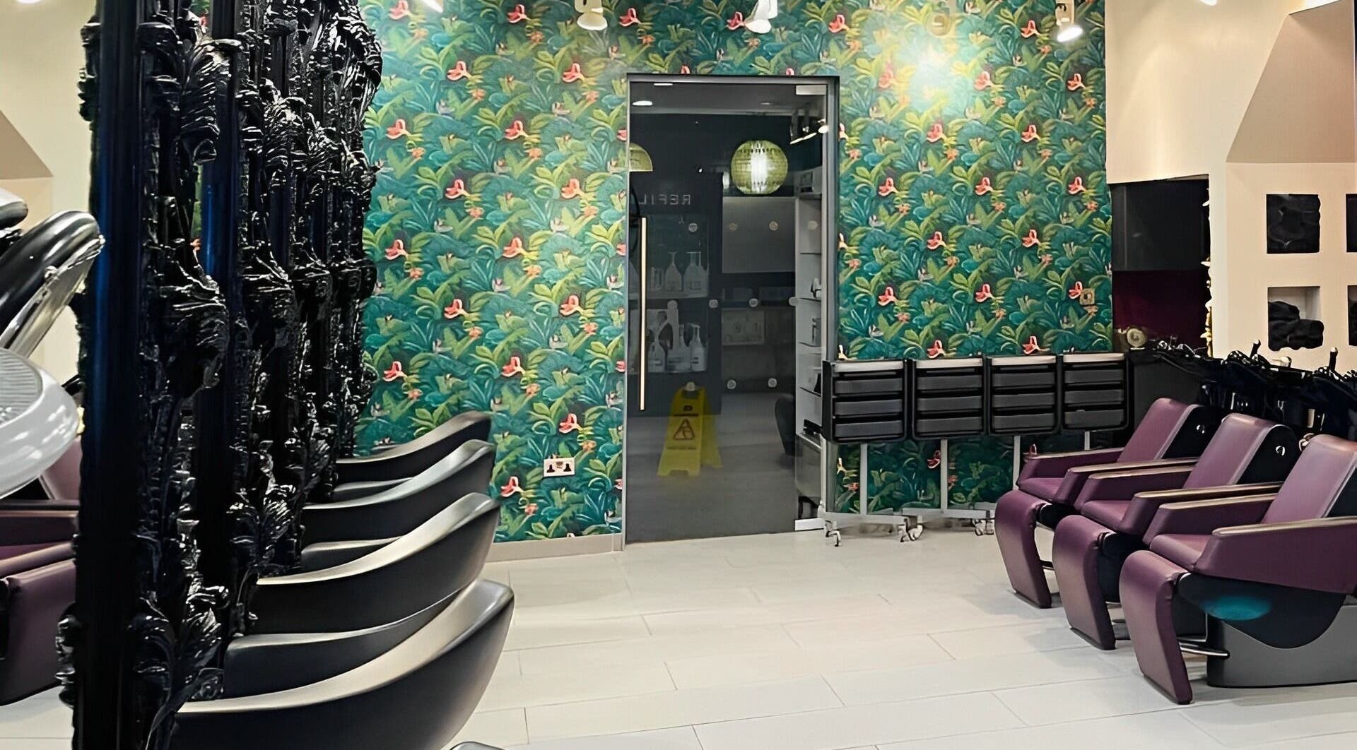 Stylish interior of C G Hair Salon Harrogate in Harrogate, England, GB with modern decor and washing stations.