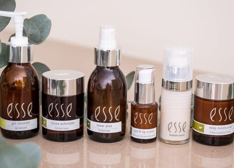 Natural skincare products on display at KreaSkin, Emanzimtoti, Kwazulu-natal, ZA, featuring lush foliage.