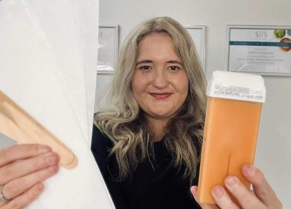 KreaSkin staff in Emanzimtoti holding waxing supplies, showcasing beauty services in Kwazulu-natal, ZA.