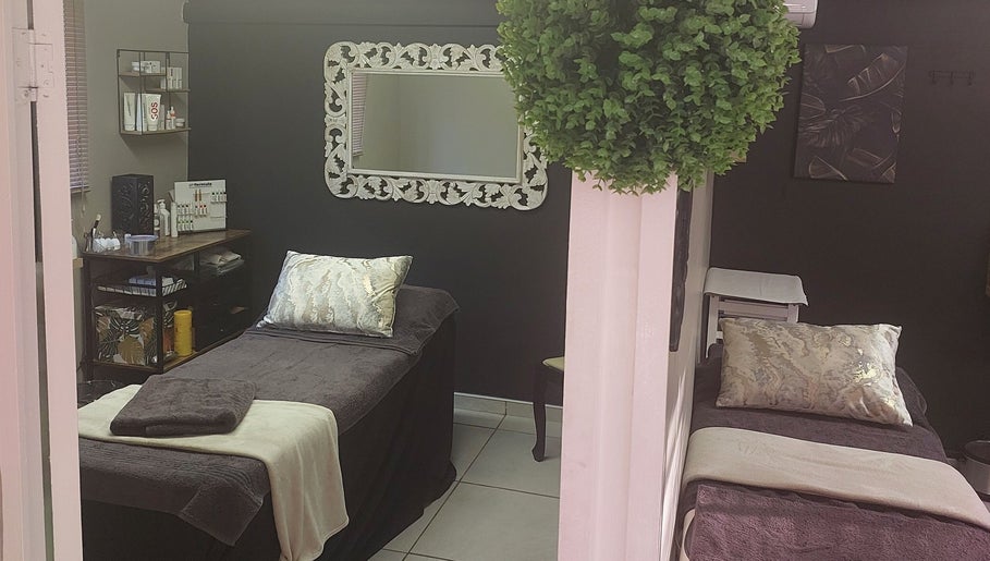 Relaxing treatment room at Casey's Place Of Beauty, Pinetown, KwaZulu-Natal, ZA. Cozy beds and elegant decor.