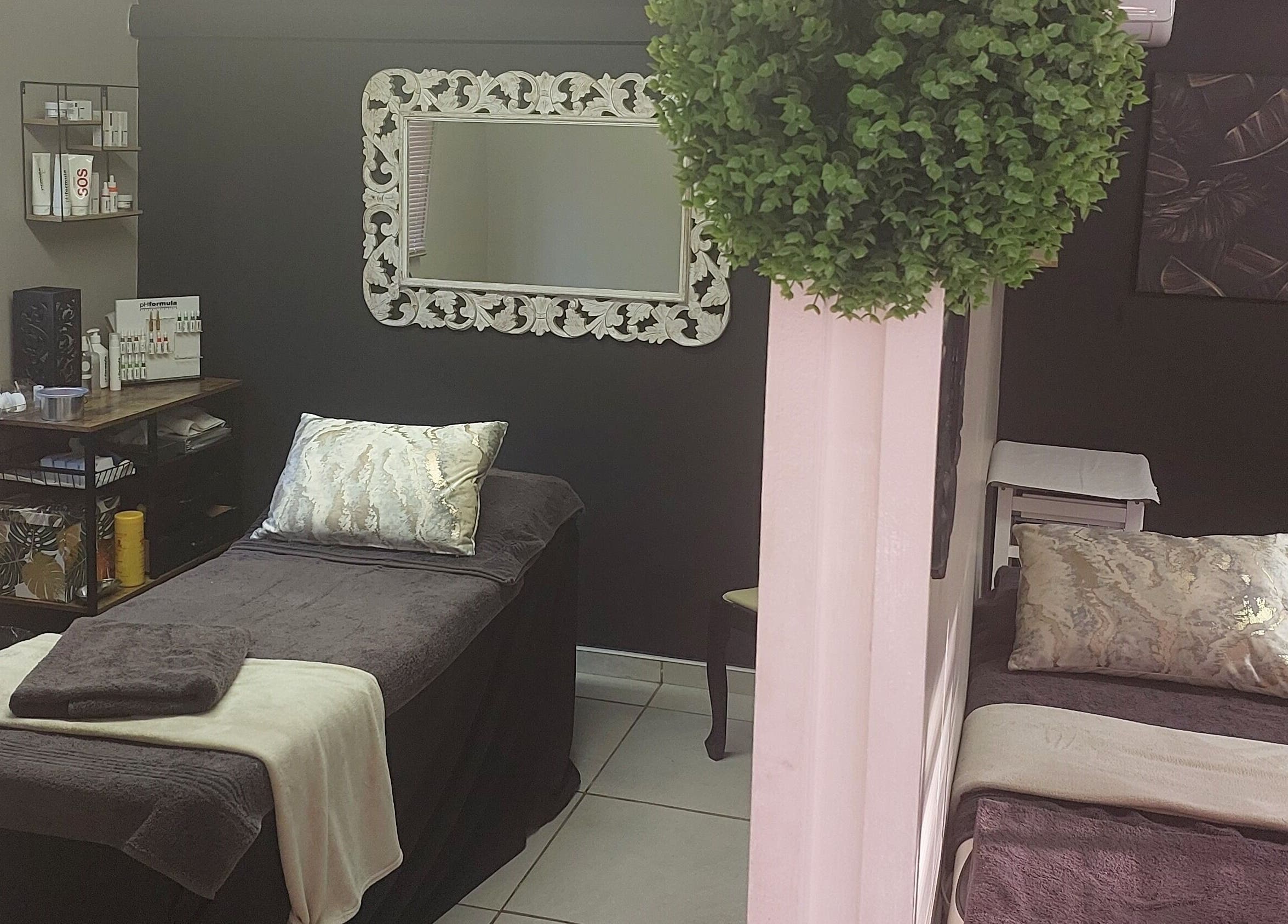 Relaxing spa room at Casey's Place Of Beauty, Pinetown, KwaZulu-Natal, ZA with elegant decor and treatment beds.