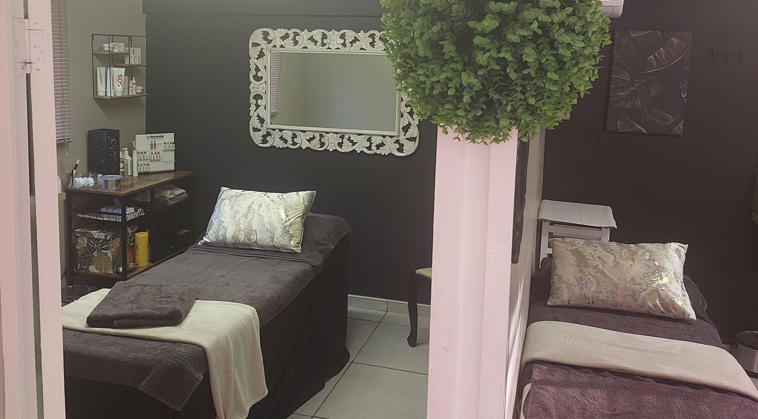 Relaxing spa room at Casey's Place Of Beauty, Pinetown, KwaZulu-Natal, ZA with elegant decor and treatment beds.