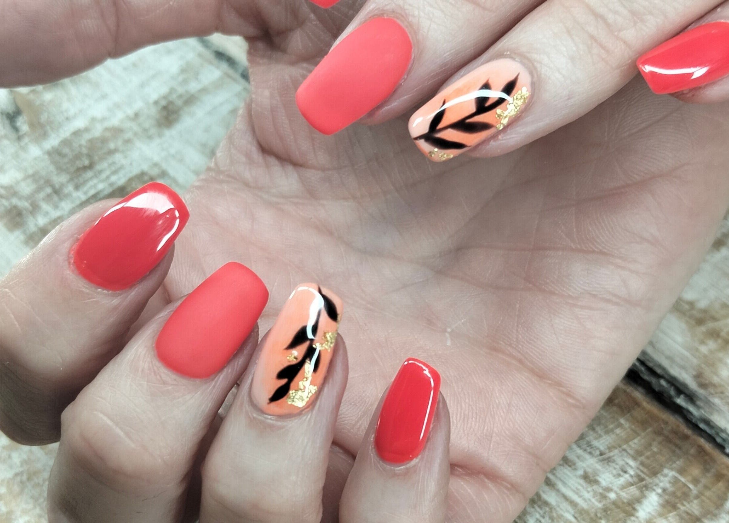Stylish coral nails with leaf design at Casey's Place Of Beauty, Pinetown, KwaZulu-Natal, ZA.