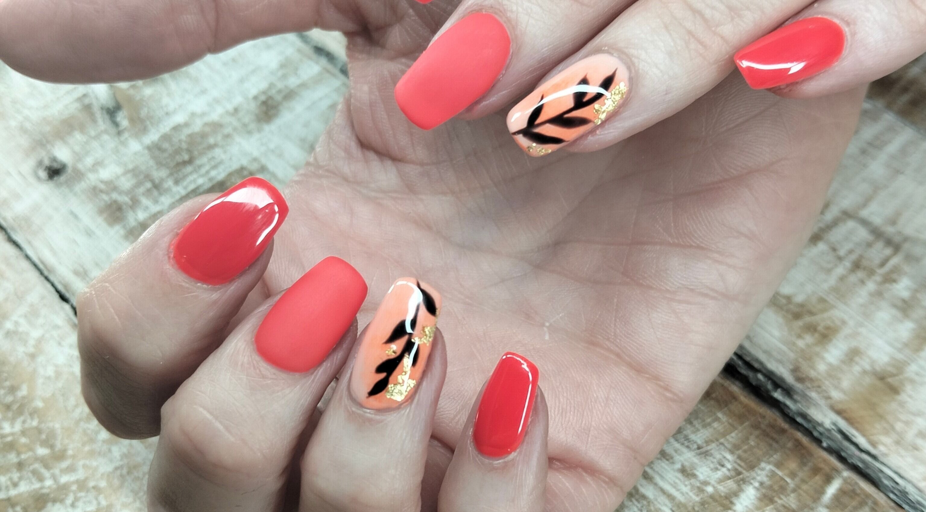 Stylish coral nails with leaf design at Casey's Place Of Beauty, Pinetown, KwaZulu-Natal, ZA.