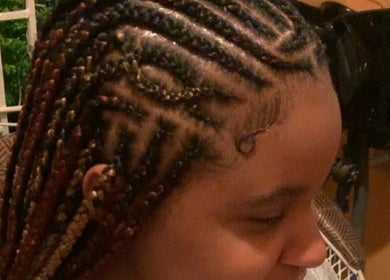 Beautiful braided hairstyle at Kay’s Braiding in Portmore, St. Catherine Parish, JM, showcasing intricate patterns.
