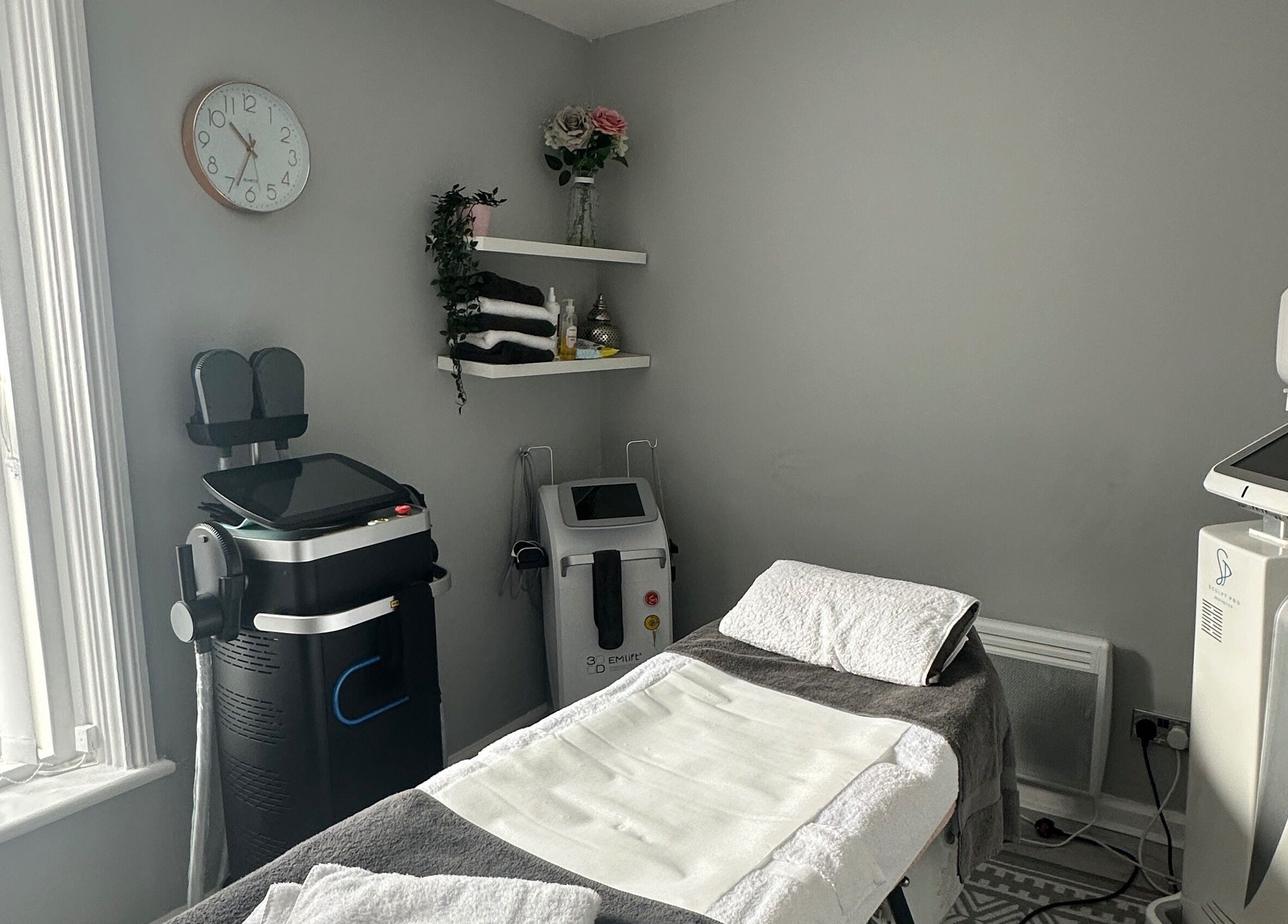 Modern treatment room at Totally Transformed, Newcastle upon Tyne, England, GB with spa equipment and decor.