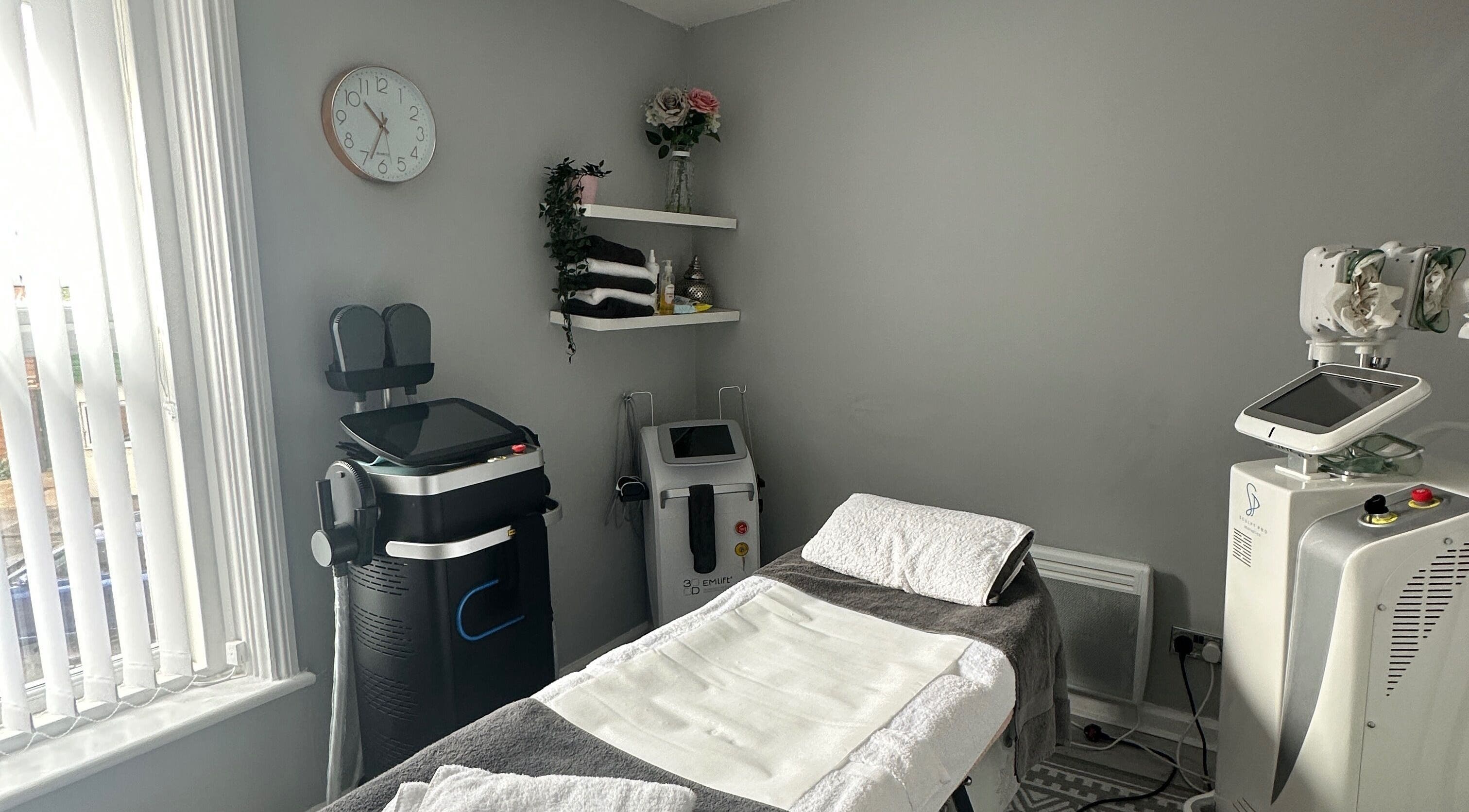 Modern treatment room at Totally Transformed, Newcastle upon Tyne, England, GB with spa equipment and decor.