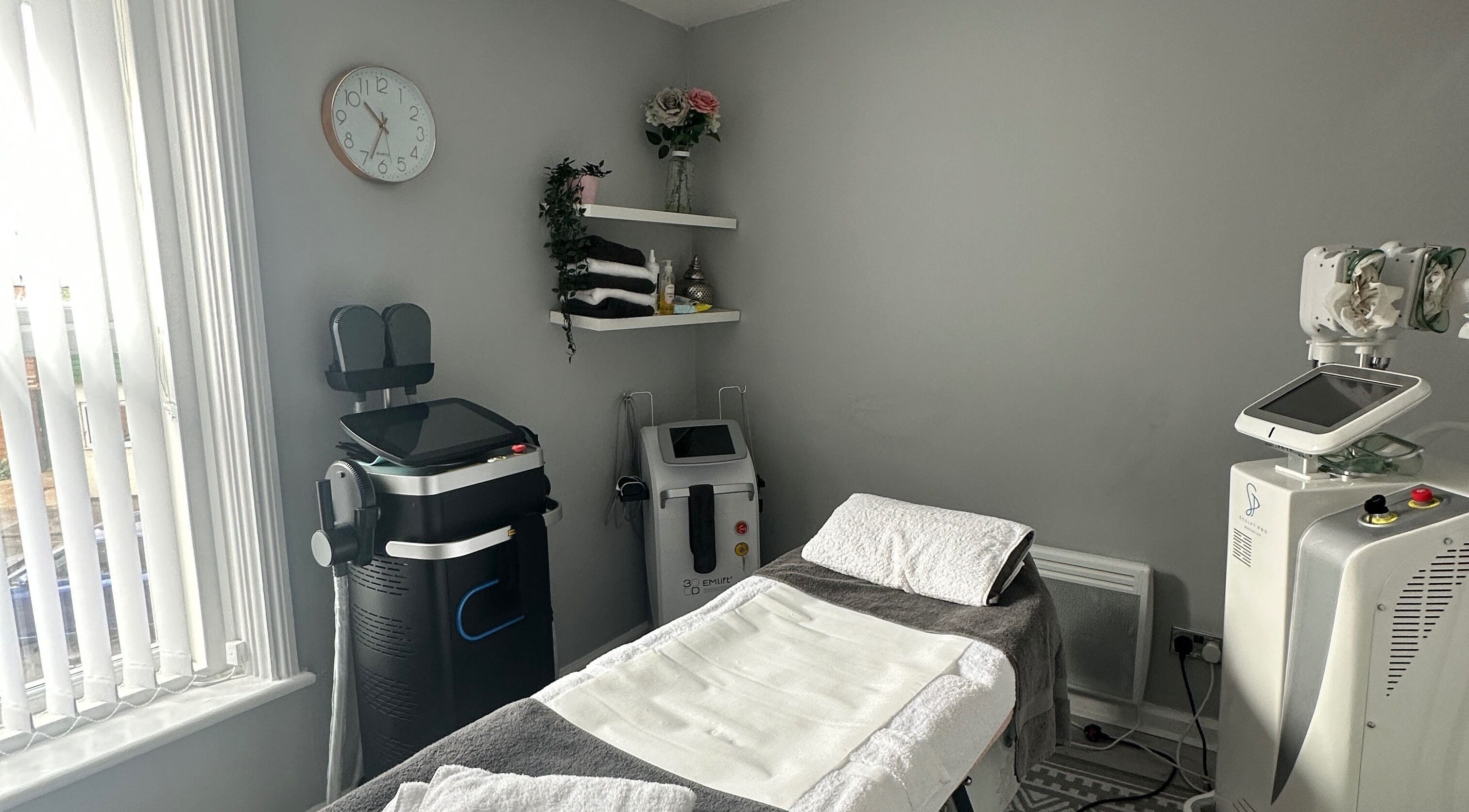 Modern treatment room at Totally Transformed, Newcastle upon Tyne, England, GB with spa equipment and decor.