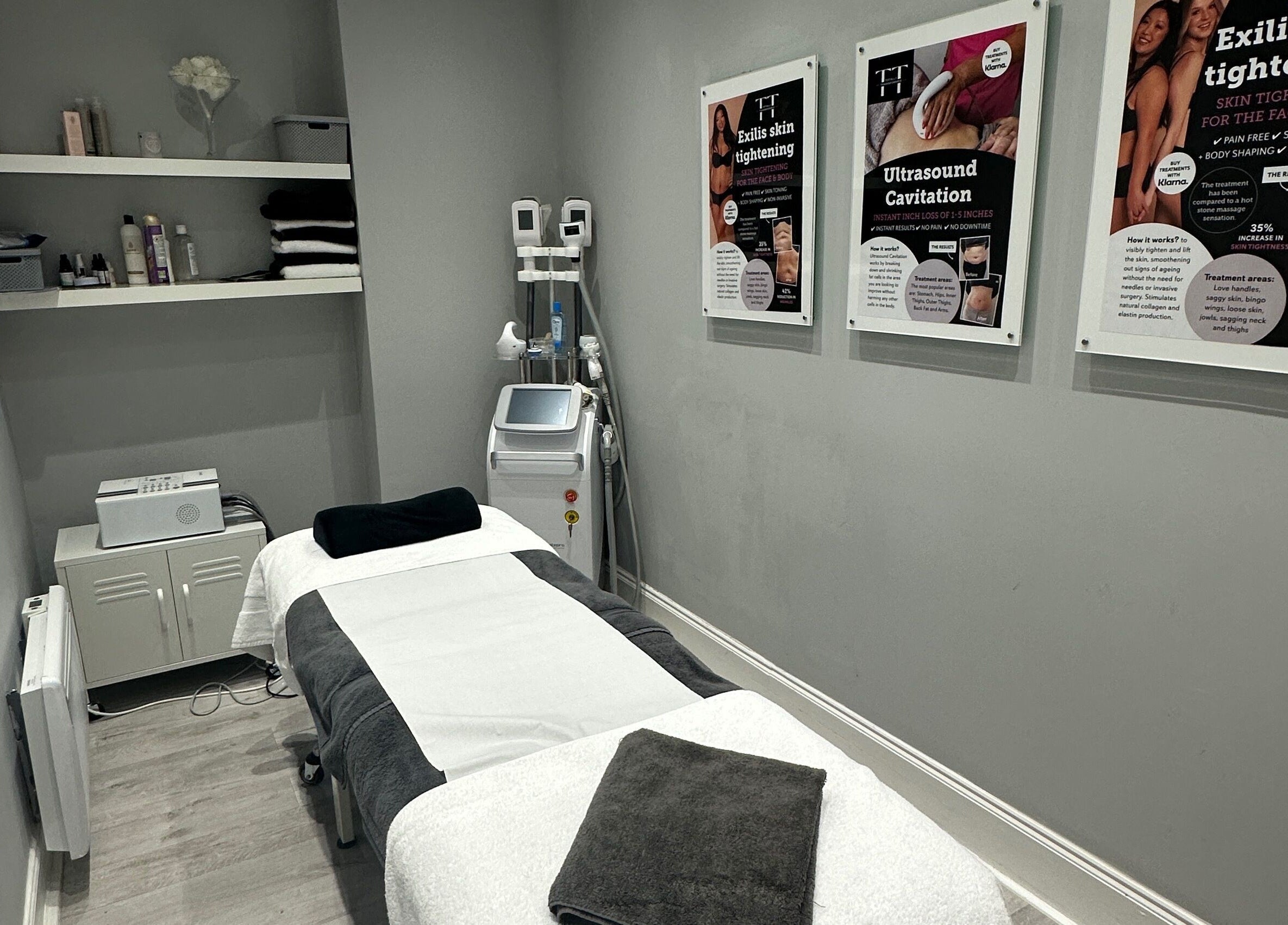 Calm therapy room at Totally Transformed, Newcastle upon Tyne, England, GB, featuring treatment bed and skincare products.